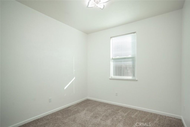 empty room with light colored carpet