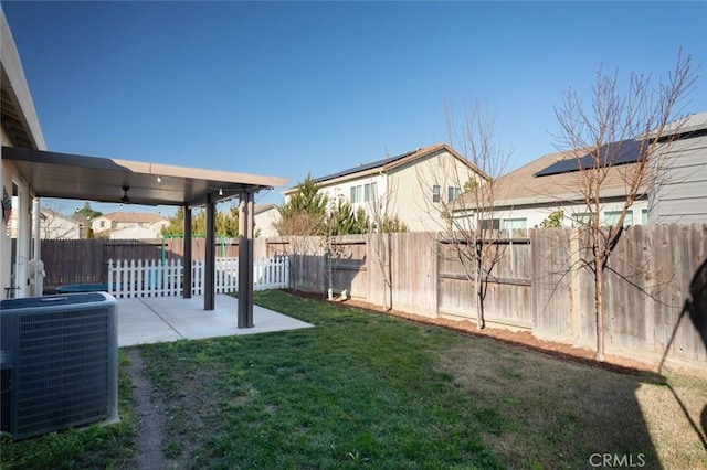 view of yard featuring cooling unit and a patio