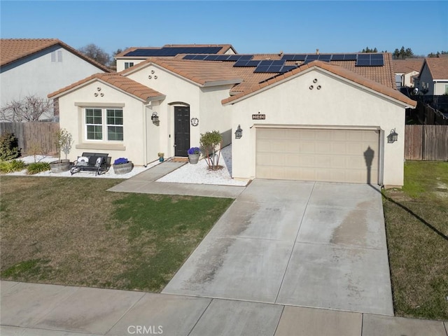 view of front of home featuring a garage, a front lawn, and solar panels