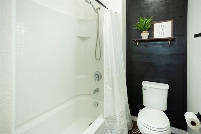 bathroom featuring toilet and shower / bathtub combination with curtain