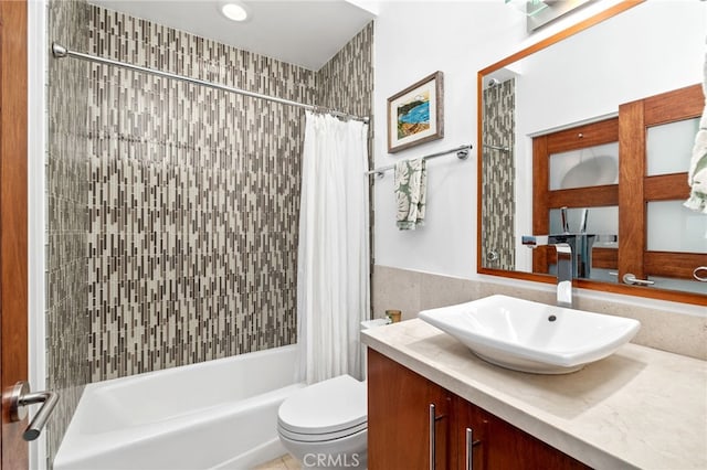 full bath featuring vanity, toilet, and shower / tub combo with curtain