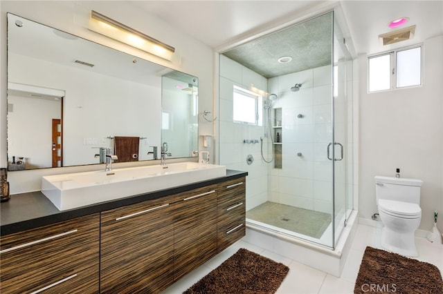 full bathroom with vanity, visible vents, tile patterned flooring, a shower stall, and toilet