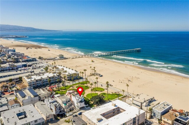 bird's eye view with a water view and a beach view