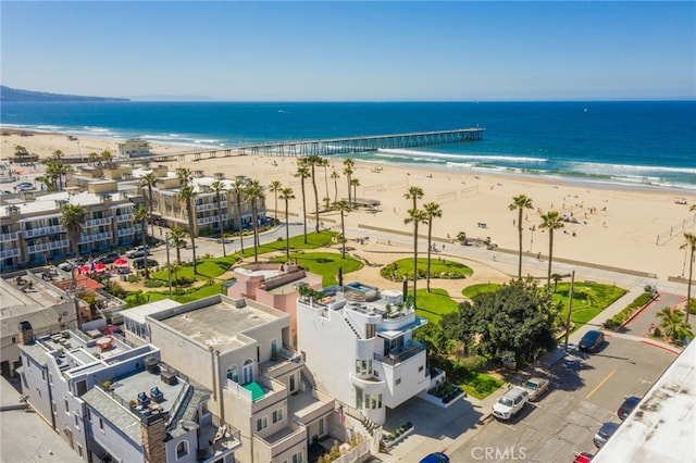 bird's eye view featuring a water view and a view of the beach