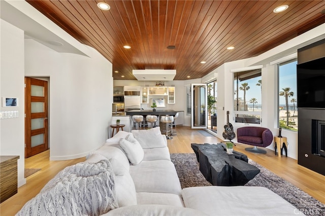 living room with recessed lighting, wooden ceiling, and light wood-style floors