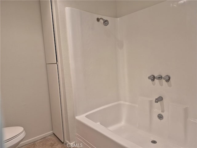 bathroom with tile patterned floors and toilet