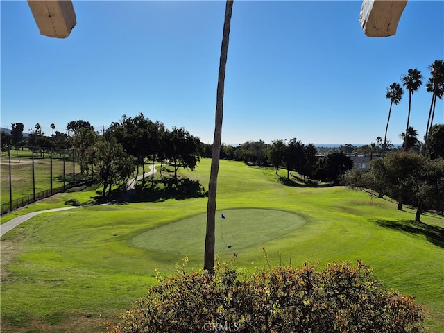 view of home's community featuring a lawn