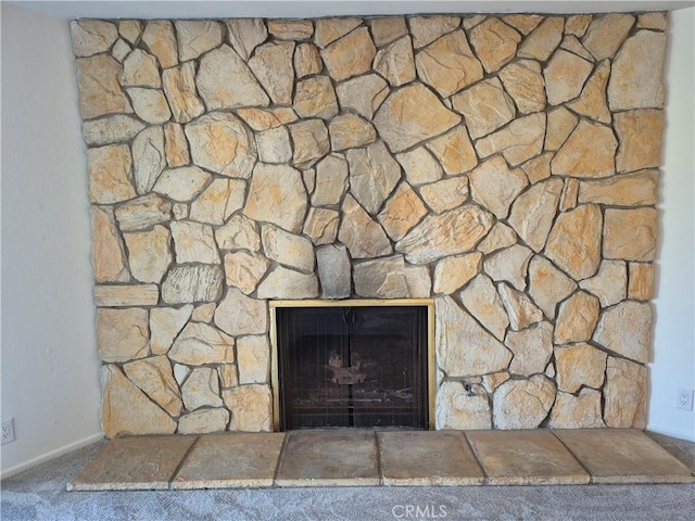 interior details featuring carpet floors and a fireplace