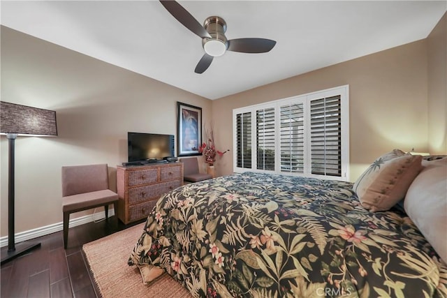 bedroom with ceiling fan and dark hardwood / wood-style floors