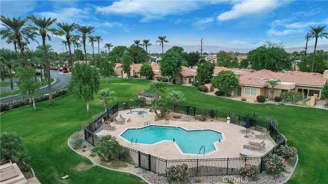 view of pool featuring a patio and a lawn