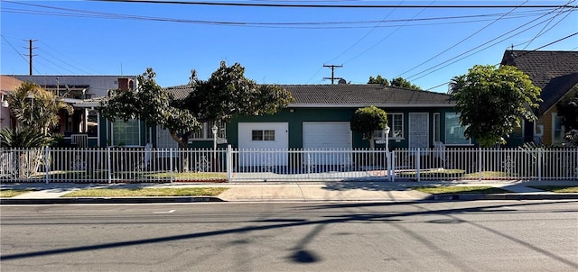 view of front of property with a garage