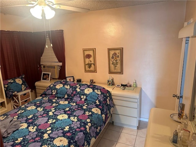 tiled bedroom with a textured ceiling, ceiling fan, and cooling unit