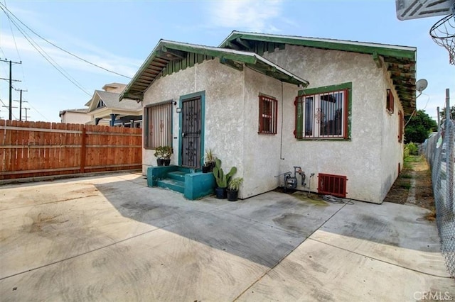 back of property with a patio area