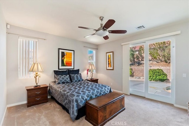 carpeted bedroom featuring access to outside and ceiling fan