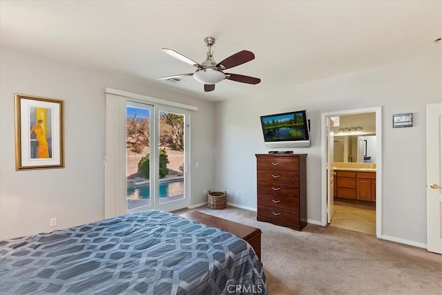 bedroom featuring access to exterior, ceiling fan, ensuite bath, and light carpet