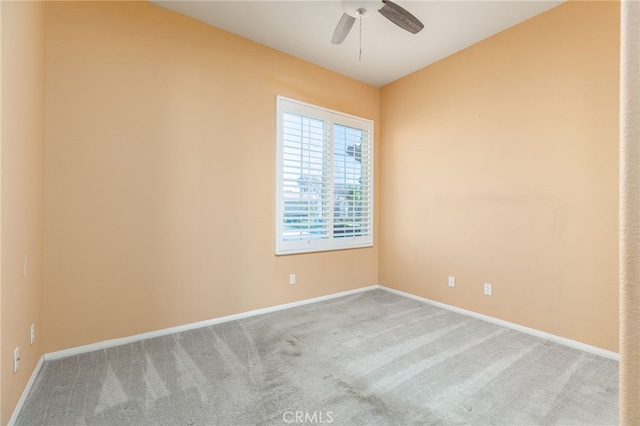 unfurnished room featuring carpet and ceiling fan