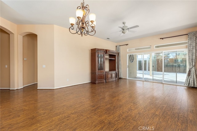 unfurnished living room with dark hardwood / wood-style floors and ceiling fan with notable chandelier