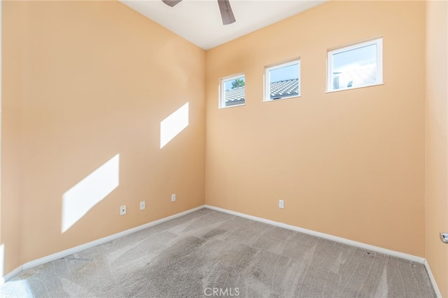 unfurnished room featuring ceiling fan and light colored carpet