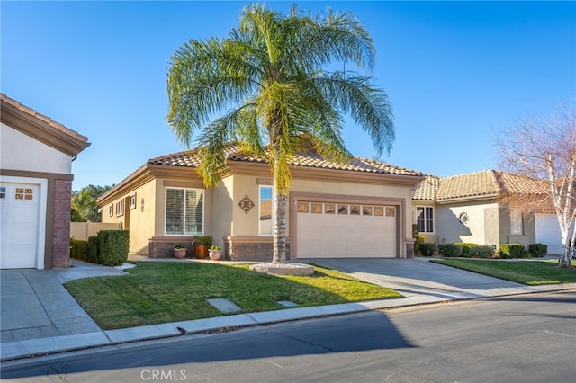 mediterranean / spanish-style house featuring a front lawn