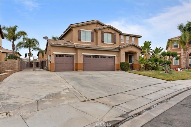 view of front of home featuring a garage and a front yard