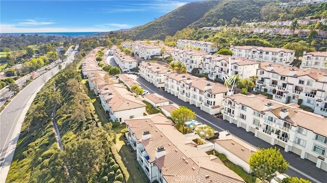 birds eye view of property featuring a mountain view