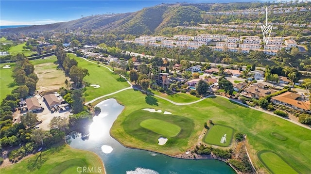 drone / aerial view with a water and mountain view