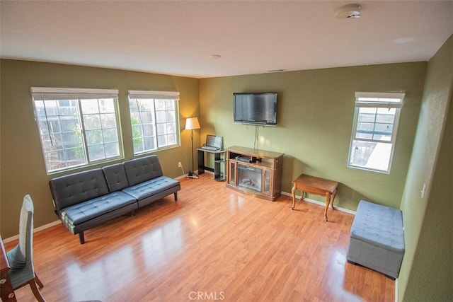 living area featuring light hardwood / wood-style flooring and a wealth of natural light