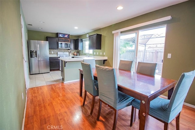 dining room with light hardwood / wood-style flooring