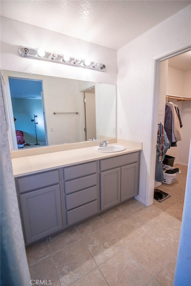 bathroom featuring vanity and a textured ceiling