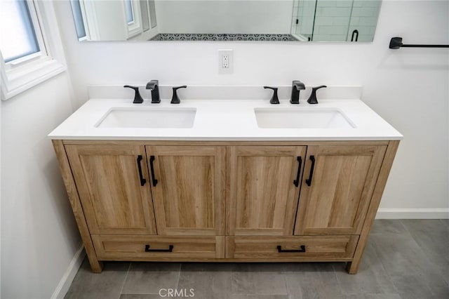 bathroom with double vanity and a sink