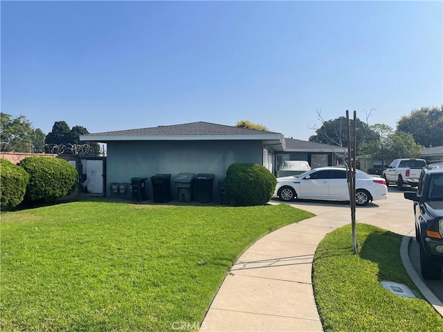 view of side of property with a yard