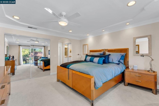 bedroom featuring ceiling fan, light colored carpet, and ornamental molding