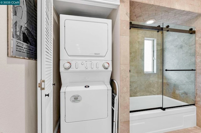 laundry area featuring stacked washer / dryer