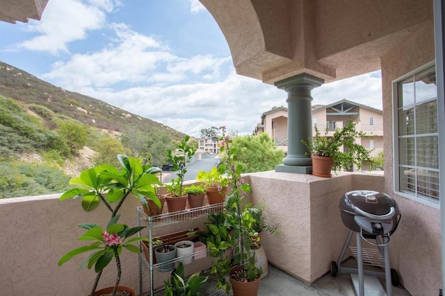 balcony with a mountain view and grilling area