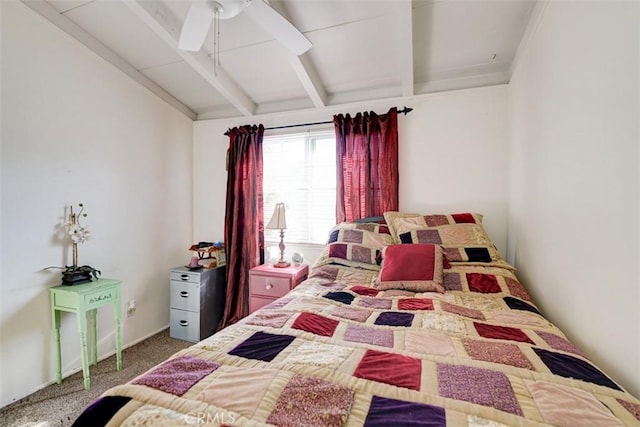 bedroom with carpet flooring, ceiling fan, and vaulted ceiling with beams