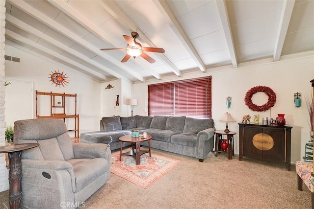 living room featuring carpet flooring, ceiling fan, and vaulted ceiling with beams