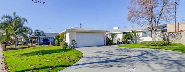 ranch-style home with a garage and a front yard