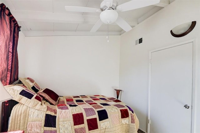 bedroom with beam ceiling and ceiling fan