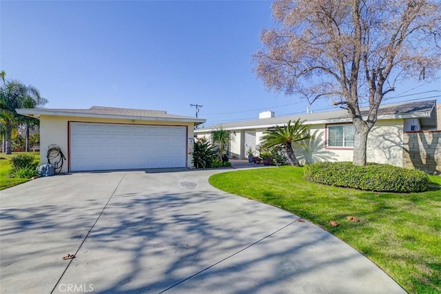 single story home featuring a front yard and a garage