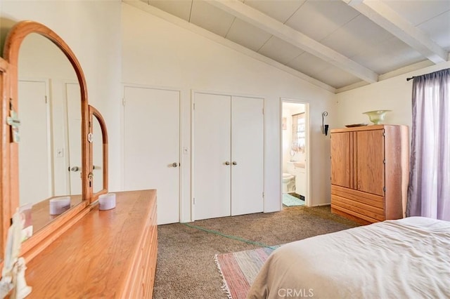 carpeted bedroom featuring lofted ceiling with beams and ensuite bath