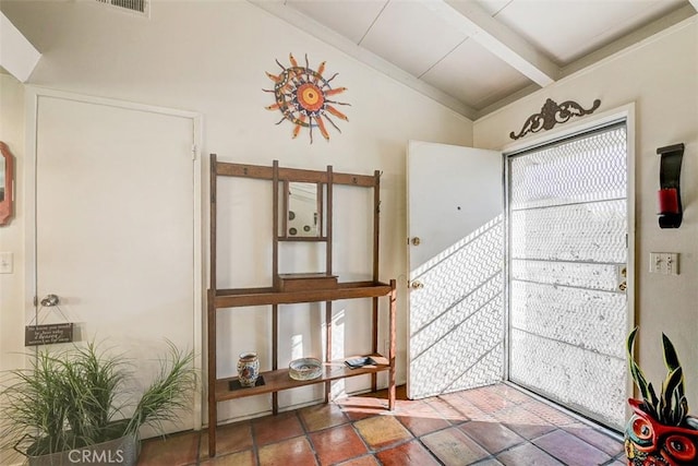 entrance foyer with lofted ceiling with beams and a healthy amount of sunlight