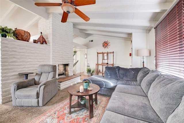 living room featuring carpet flooring, vaulted ceiling with beams, ceiling fan, and a stone fireplace