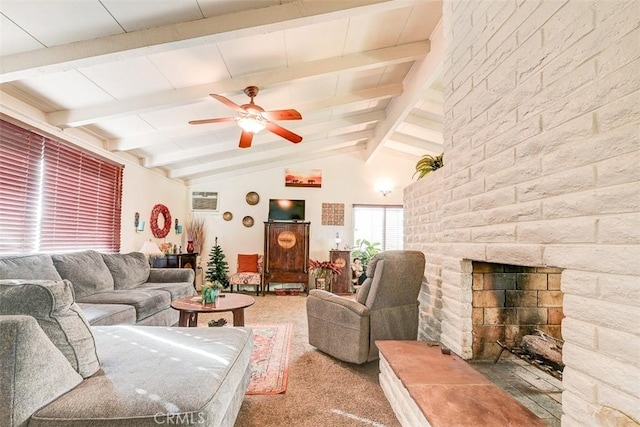 carpeted living room featuring ceiling fan, a fireplace, and lofted ceiling with beams