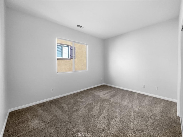 spare room with carpet floors