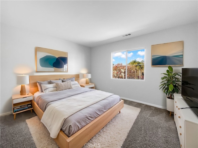 bedroom with baseboards, carpet floors, and visible vents