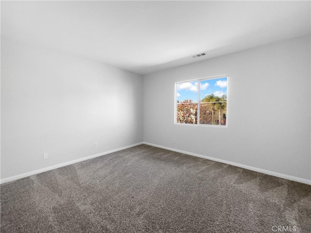 unfurnished room featuring carpet flooring