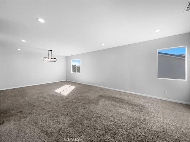 spare room with baseboards, carpet flooring, and recessed lighting