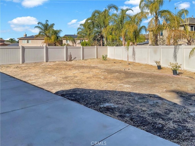 view of yard with a fenced backyard