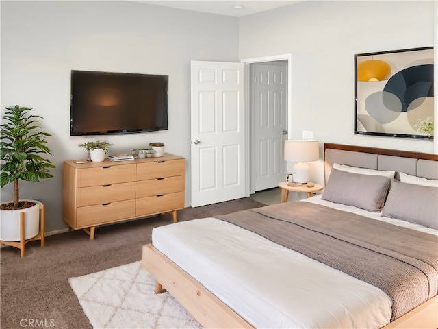 bedroom with dark carpet