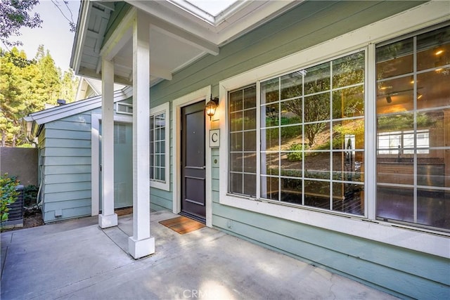 doorway to property featuring covered porch